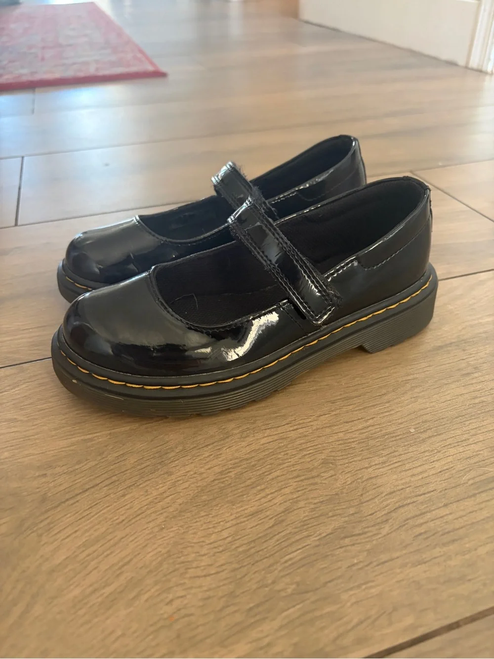 Dr. Martens Girls' Black Patent Mary Janes with Yellow Welt Stitching
